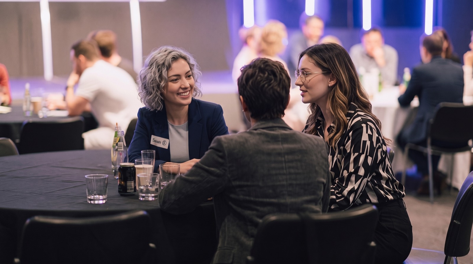 Friends chatting over drinks at a recent night